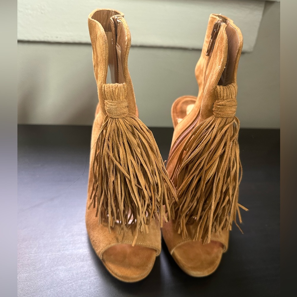 An authentic CHRISTIAN LOUBOUTIN Suede Otoka Fringe booties (like new)